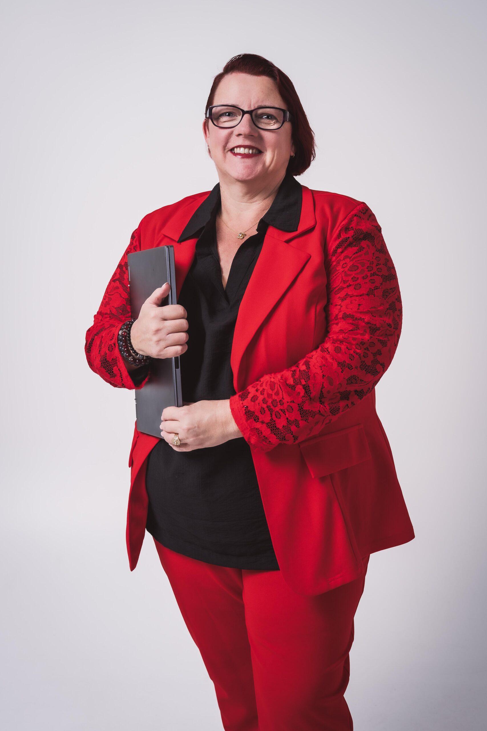Paula Burgess holding a computer